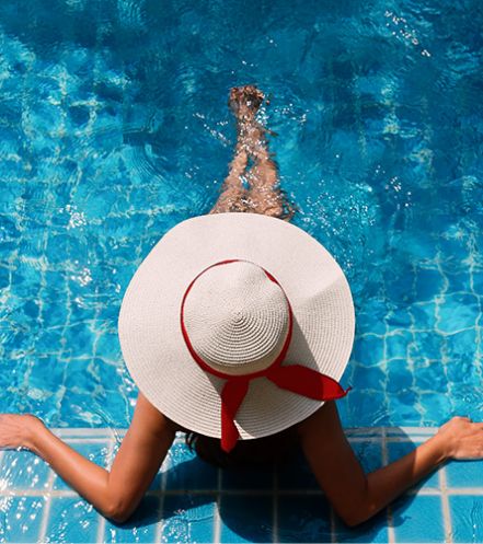 Person lounging in the pool